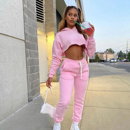 Elegant pink jogger tracksuit from the women's fleece running set, featuring a comfortable fit and chic splicing details.