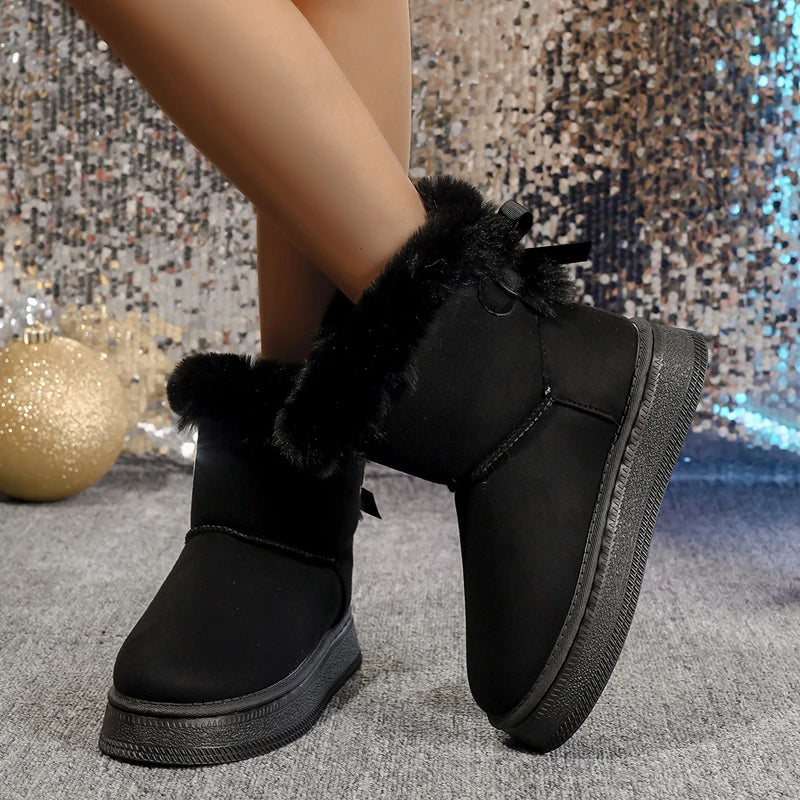 Beautifully designed women's winter boots, featuring a soft microfiber exterior and a round toe, embodying modern luxury and functionality in every step.
