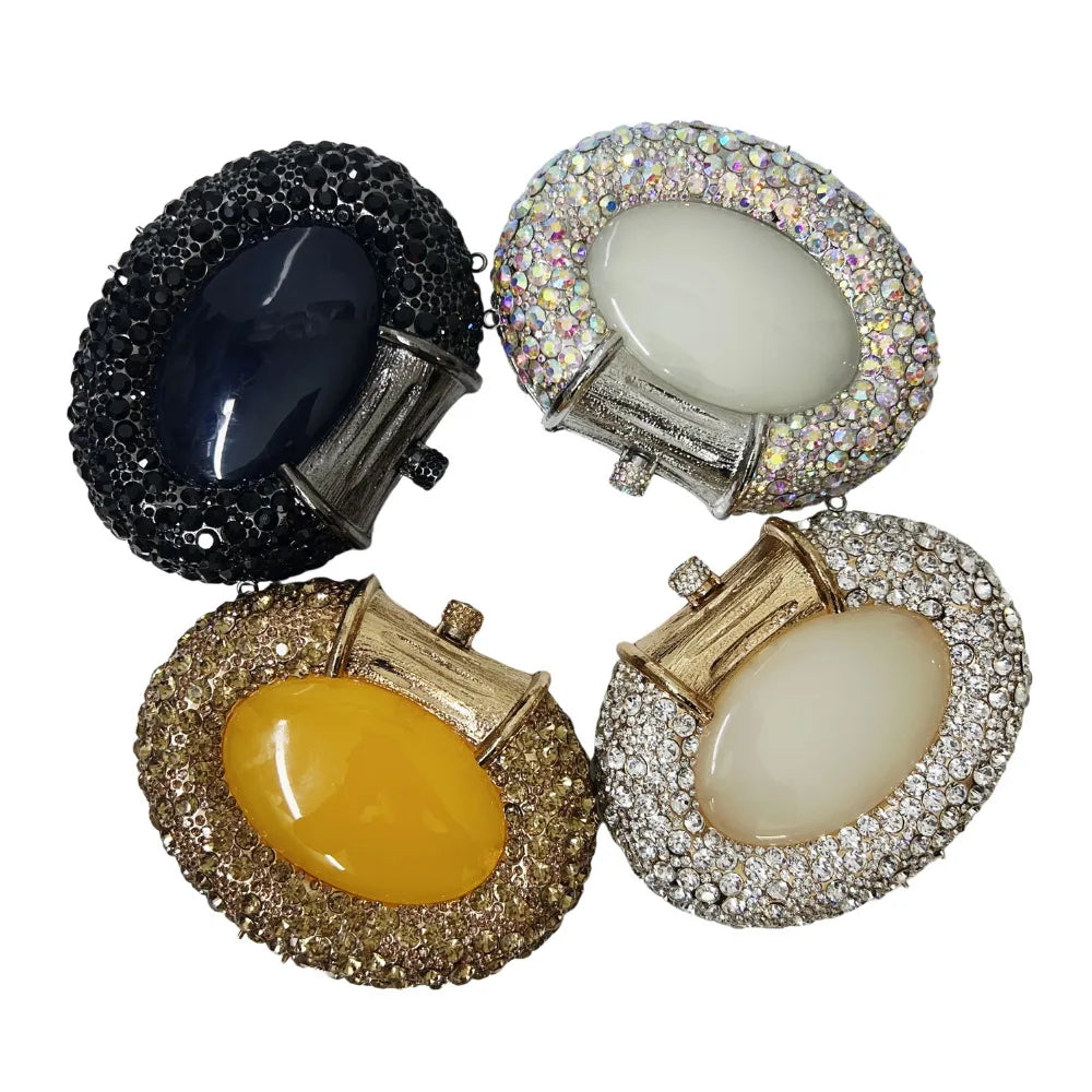 Luxury metallic women's clutch bag featuring crystals, perfect for evening parties and formal events.