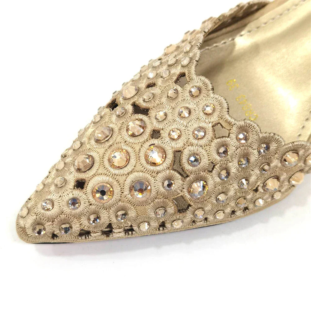 Stylish side view of Venus Chan high heel gold shoes showcasing pointed toe and chic butterfly-knot detail.