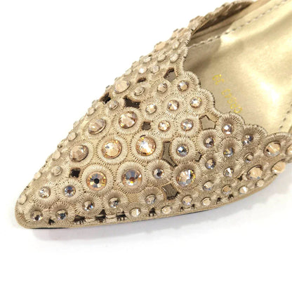 Stylish side view of Venus Chan high heel gold shoes showcasing pointed toe and chic butterfly-knot detail.