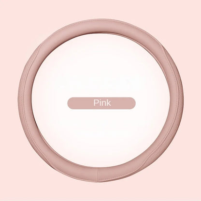 Close-up view of a high-quality, non-slip Napa leather steering wheel cover, showcasing intricate perforations and a stylish patchwork finish, enhancing your car's interior.