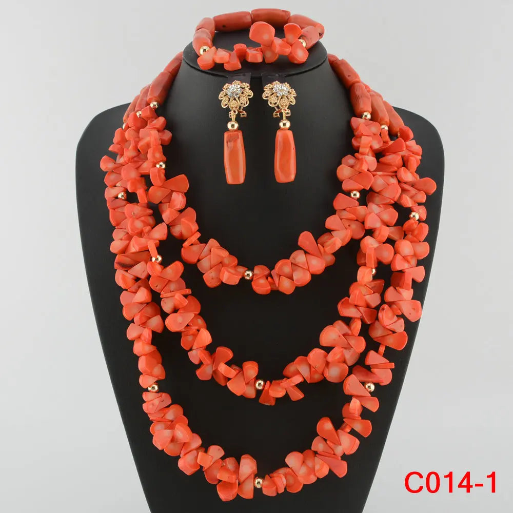 Close-up of luxurious coral bead jewellery set highlighting the fine craftsmanship and classic African design elements.