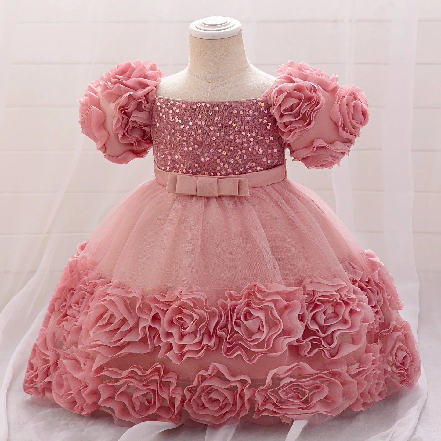 Beautiful floral appliqued knee-length gown for girls, showcasing a luxurious design suited for birthday celebrations.