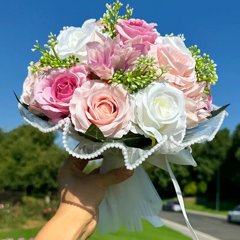 Charming wedding bouquet in silk fabric featuring babysbreath roses and intricate pearl lace, perfect for matching bridesmaid creations.