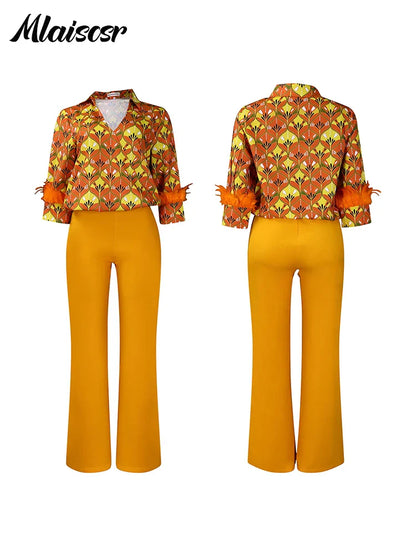 Close-up of the feather print on Mlaiscsr's long sleeve top, highlighting the delicate craftsmanship and attention to detail.