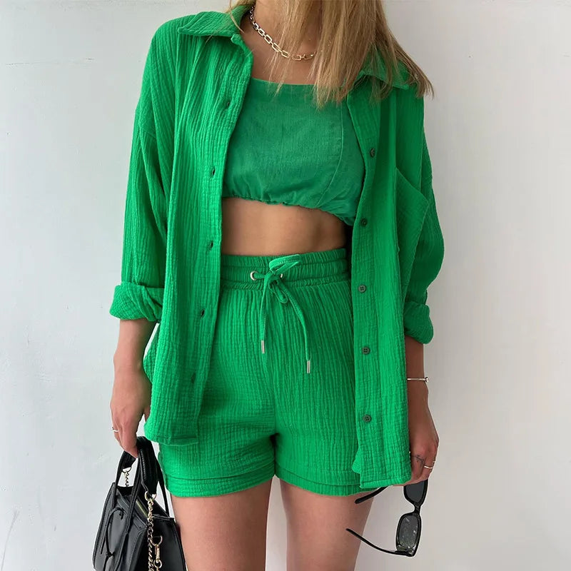 Model wearing the luxurious grass green 2-piece set, featuring a loose cardigan and shorts, highlighting a fashionable summer look for women.