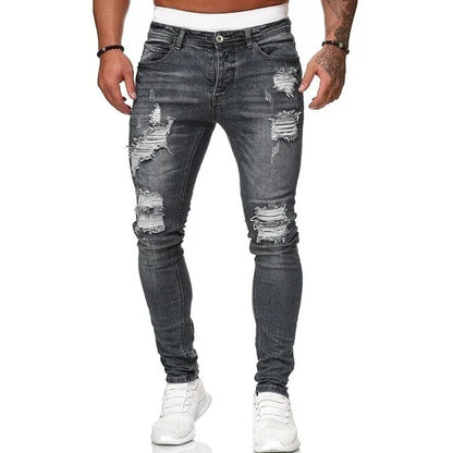 Close-up detail of luxury men's ripped skinny jeans, featuring stonewashed denim and a modern pencil fit design, ideal for stylish casual occasions.