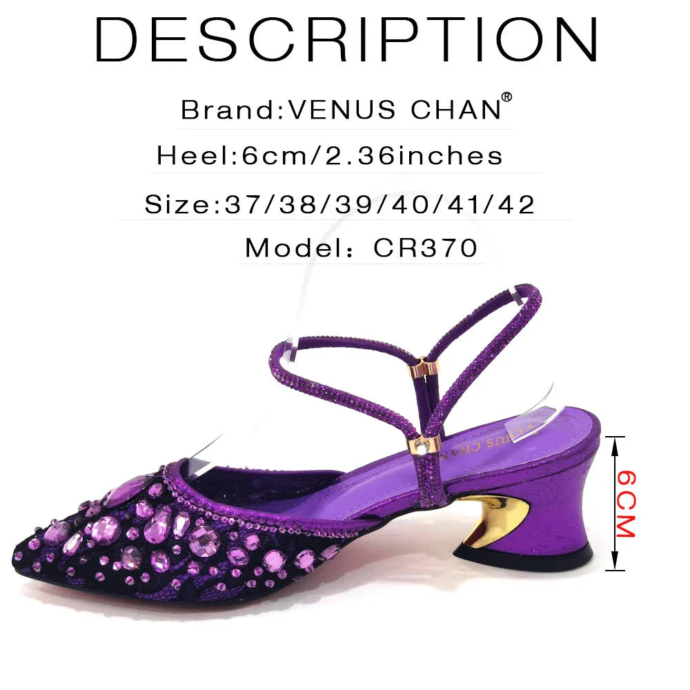 Chic black handbag with a metal handle and long chain strap, complements the Venus Chan lace high heels.