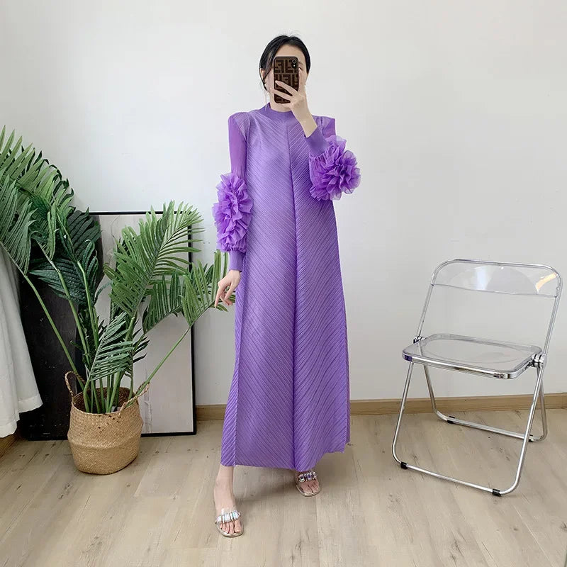 Close-up view of the luxurious pleated fabric of the Maxi Dress with petal sleeves, showcasing its elegant texture and high-quality polyester material, ideal for office or formal wear.