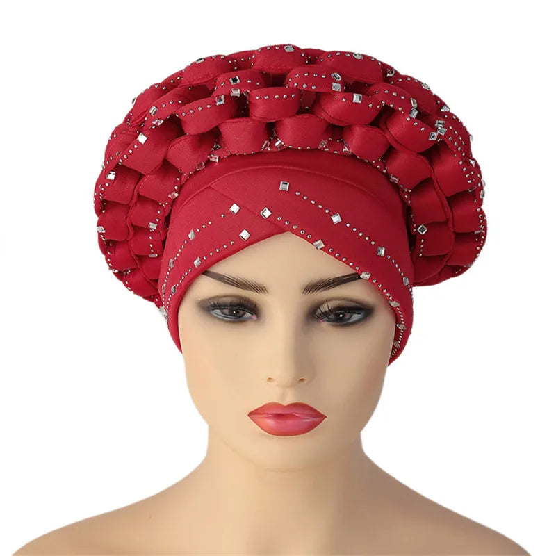 Stylish African Autogele headtie turban worn by a fashionable woman, epitomising elegance and sophistication in ceremonial attire.