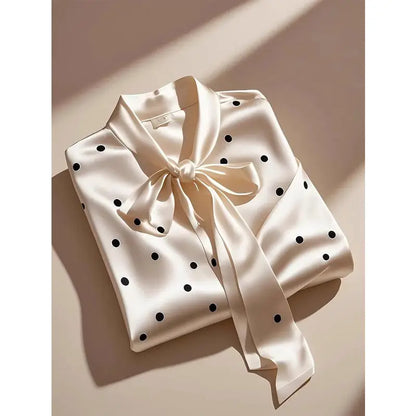 Elegant women's satin polka dot blouse featuring a chic lace-up bow design, perfect for sophisticated office wear.