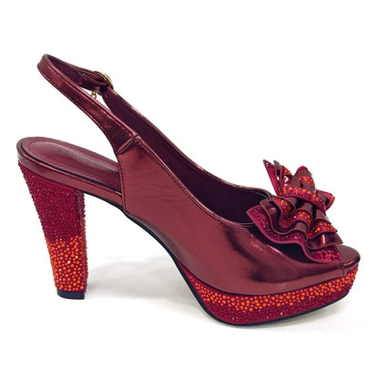 Sophisticated Green Bag from the Venus Chan Set, featuring a stunning metal handle and stylish shiny finish, perfectly complementing the matching pump shoes.