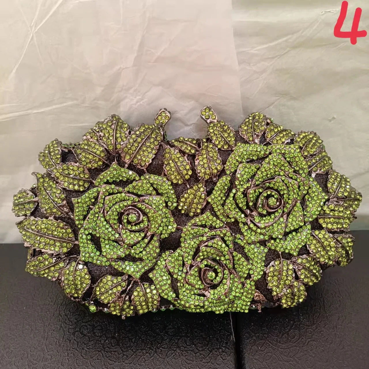 Sleek and sophisticated metallic leather minaudière clutch purse for women, embellished with crystal detailing, ideal for elevating evening attire.