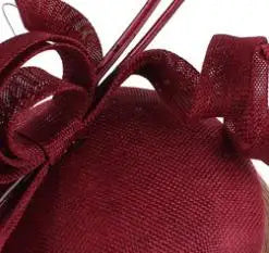 Versatile yellow hat with elegant embellishments, perfect for racing events and high tea gatherings.