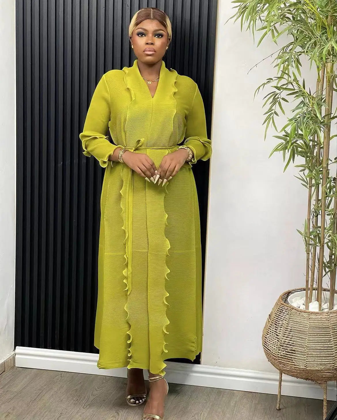 Stylish and sophisticated abaya dress designed for women, featuring a loose fit and ruffle details, embodying luxury for spring/summer outings.