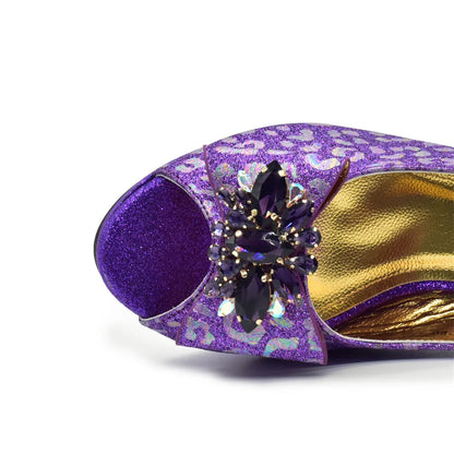 Close-up of the intricate butterfly-knot detail on fashionable purple high heel sandals for women.