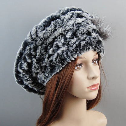 Fashionable women’s faux fur beanie and scarf, demonstrating versatile winter accessories that add elegance to any outfit.