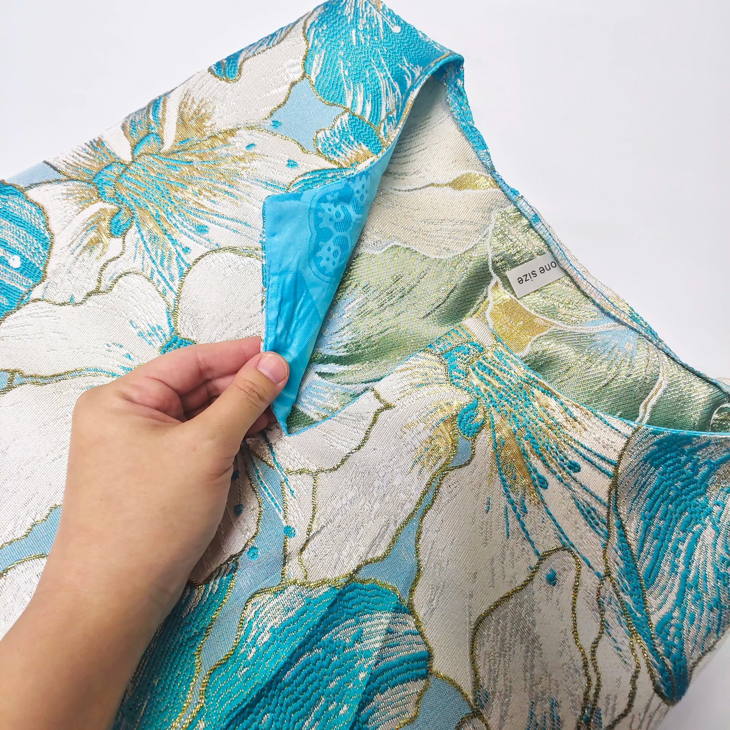 Charming African women’s boubou dress in lake blue, styled elegantly with beautiful Bazin riche embellishments, suitable for weddings and formal events.