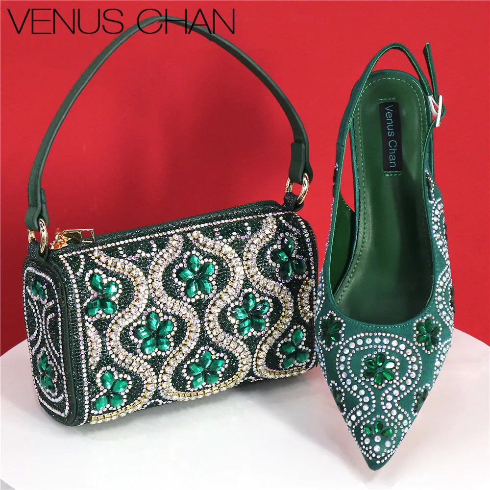 Chic fuchsia handbag featuring a metal handle and long chain strap, crafted to complement the matching high heels, ideal for evening wear and upscale events.