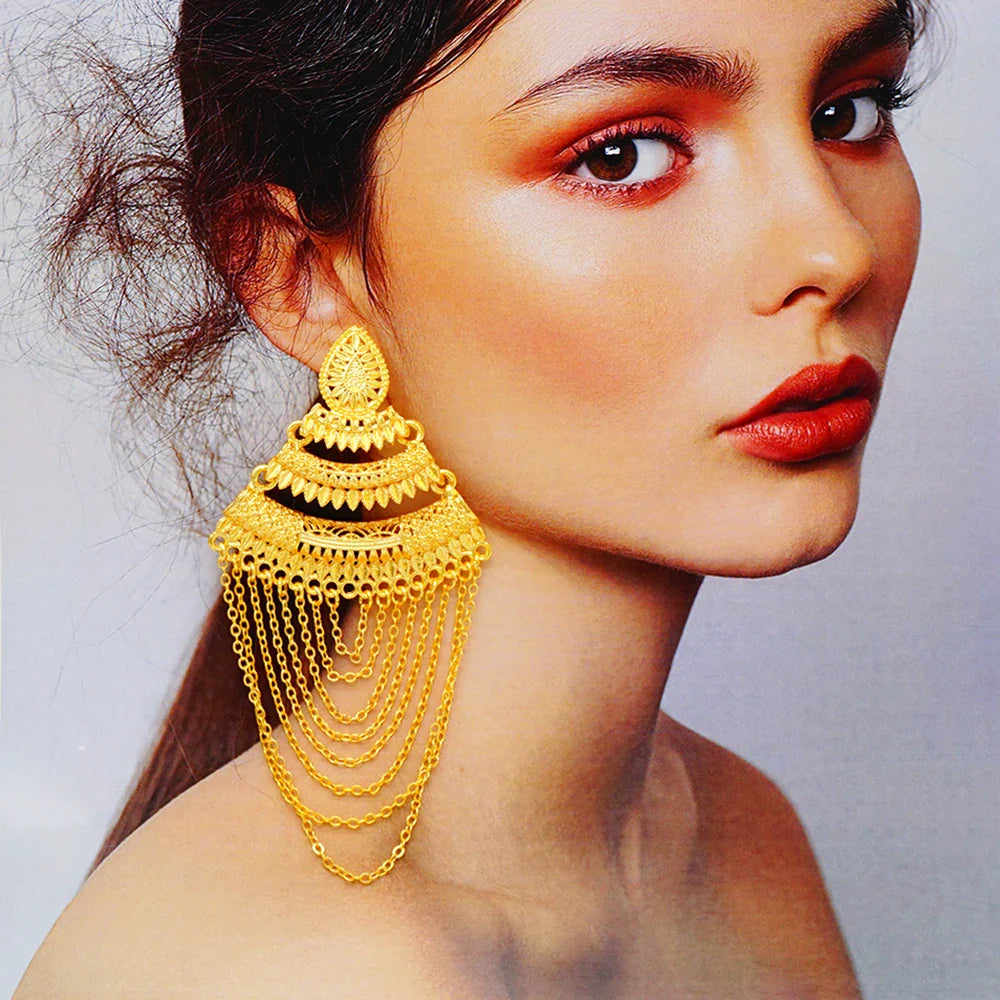 Exquisite long tassel earrings in a glamorous gold finish, a must-have accessory for wedding and party attire.