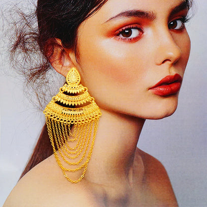 Exquisite long tassel earrings in a glamorous gold finish, a must-have accessory for wedding and party attire.