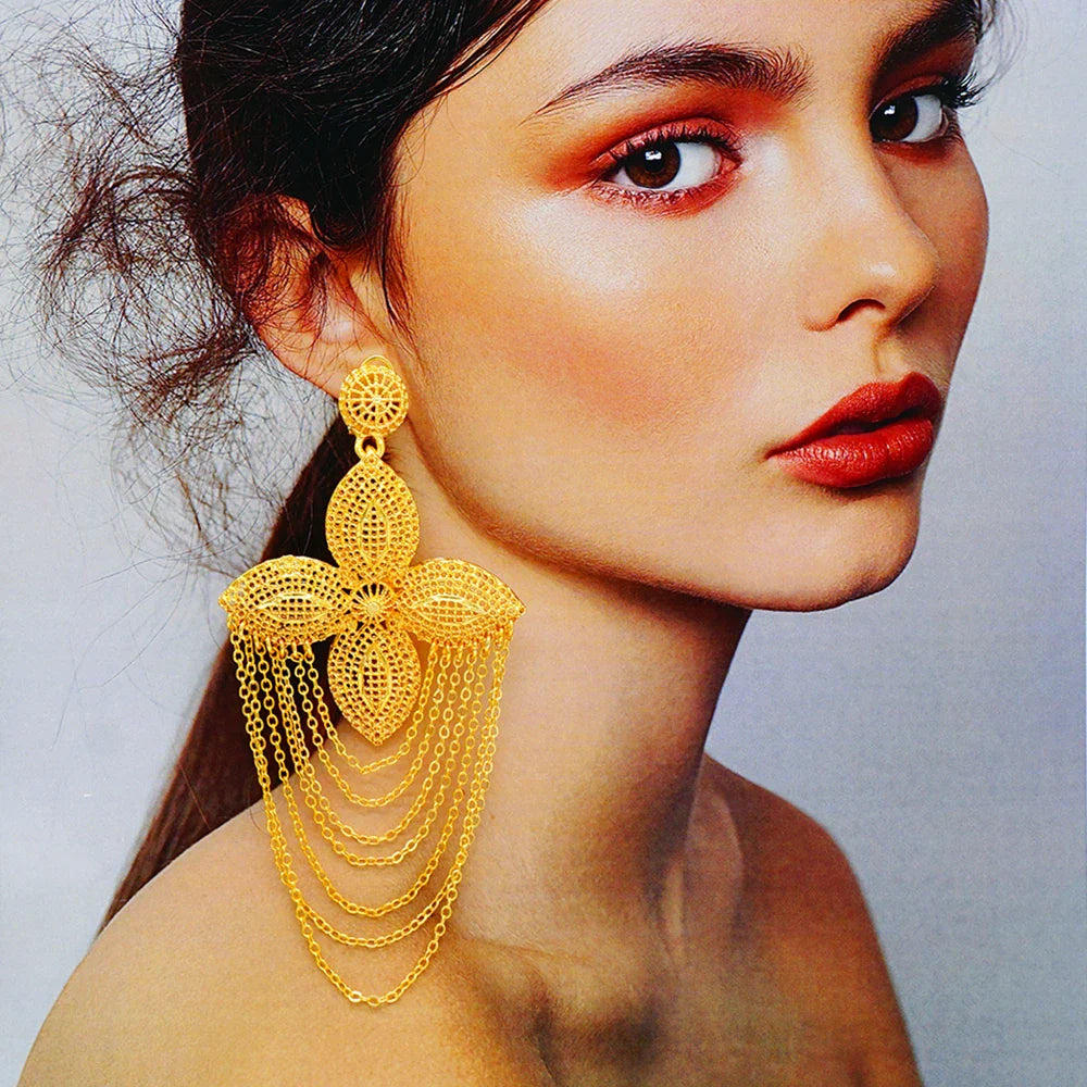 Sophisticated photographic display of trendy drop earrings, showcasing their unique geometric pattern and luxe gold finish.