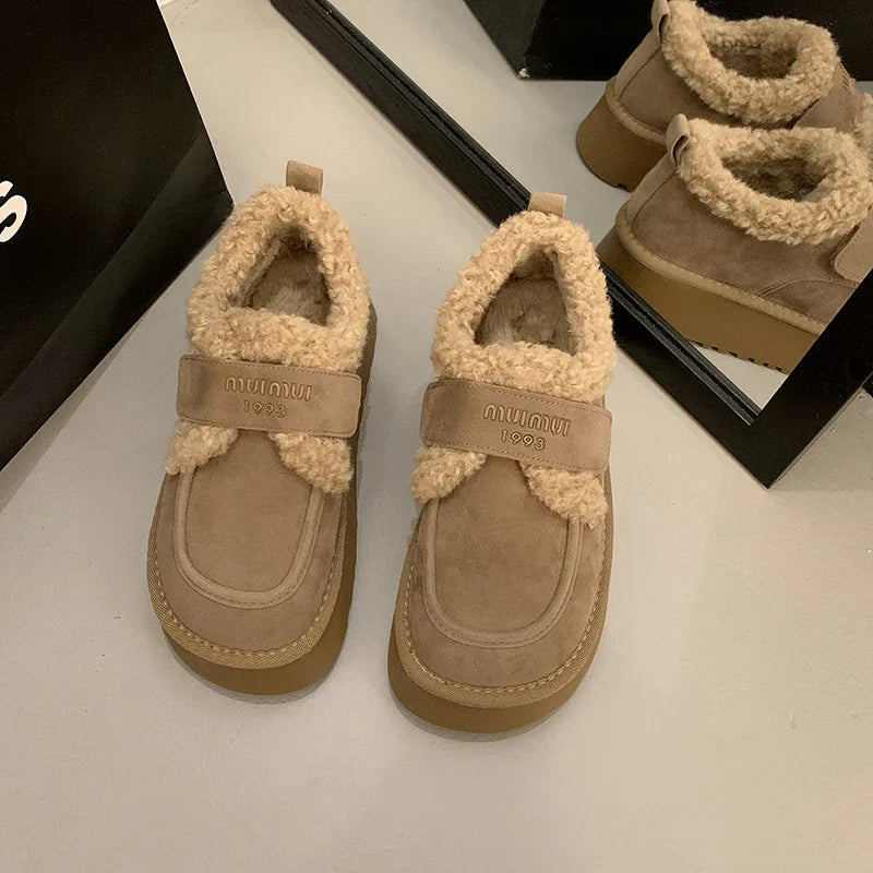 Stylish winter women's non-slip ankle snow boots adorned with a round toe design, blending functionality and chic fashion for cold seasons.