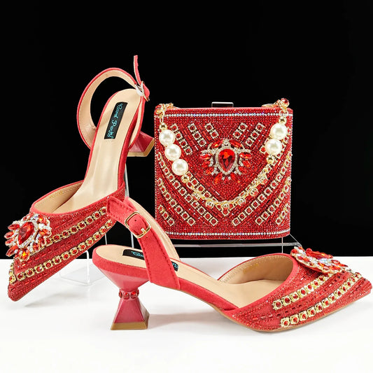 Chic red handbag set accompanying Queena Yan women's heels, designed with a long chain shoulder strap and short hand strap, ideal for sophisticated styling.