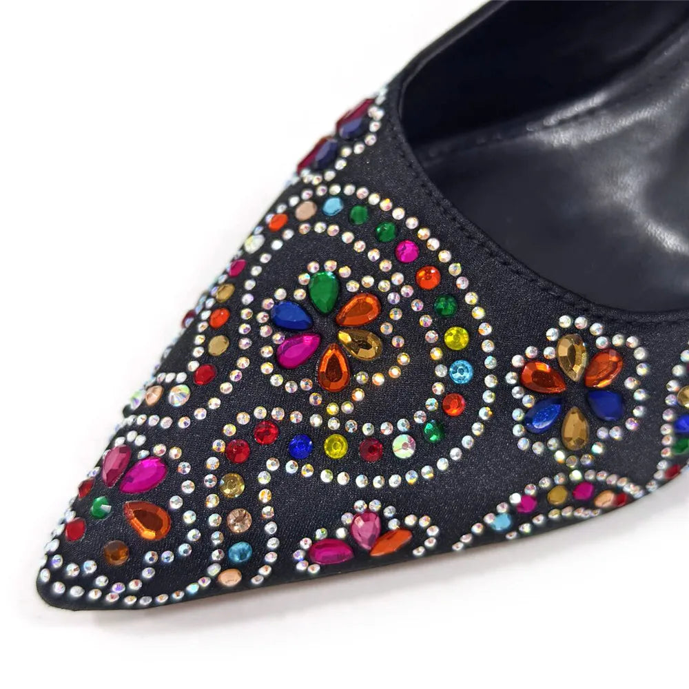 Luxurious fuchsia high heels with intricate rhinestone toe detail, complemented by a stylish matching bag set, perfect for elegant women's fashion.