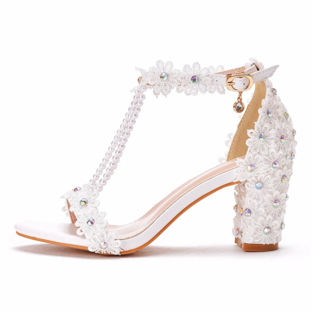 Stunning plus size gladiator sandals adorned with lace flowers, perfect for formal occasions and adding a touch of glamour.