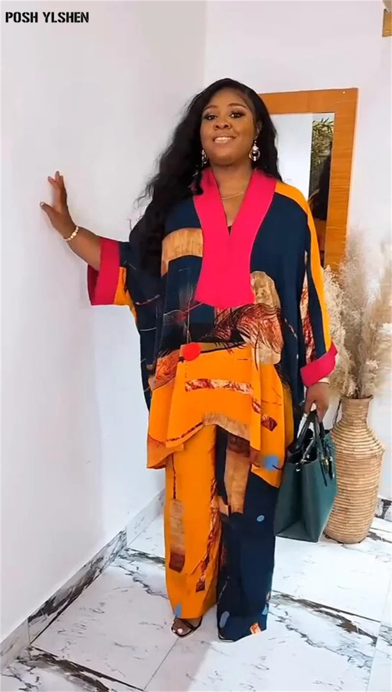 Luxurious Plus Size Ankara Dashiki 2-Piece Outfit for Women featuring elegant orange and pink print trousers, ideal for sophisticated style.