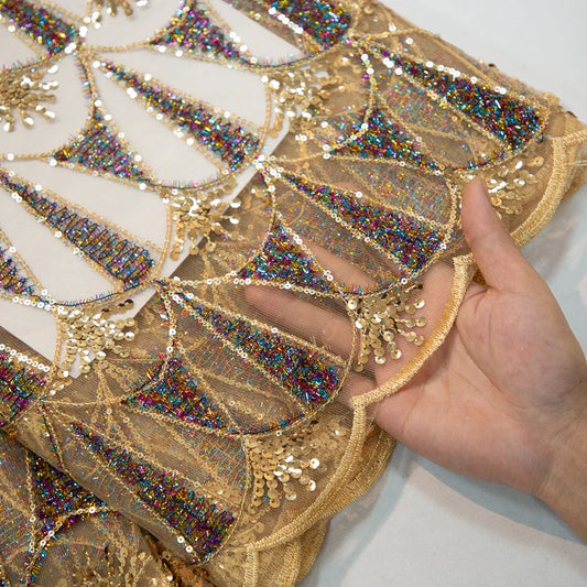 Richly textured mesh lace fabric in vibrant hues, ideal for creating sophisticated attire for special occasions.