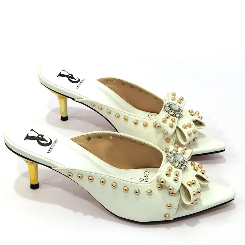 Elegant women's high heeled shoes featuring a stylish rivet design in vibrant colours, perfect for a luxurious summer look.