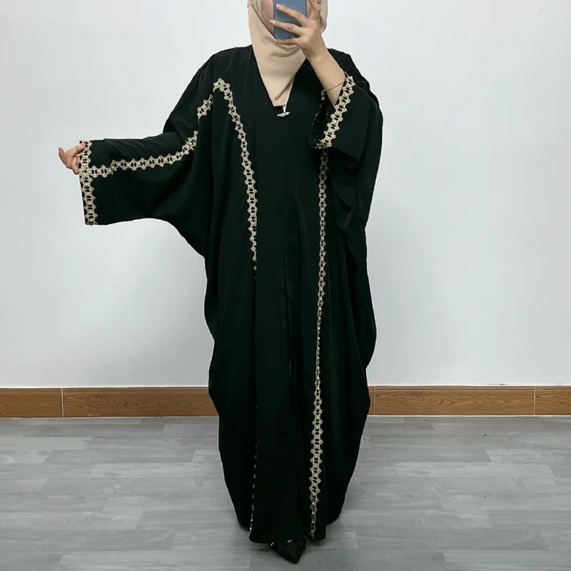Luxurious golden velvet Moroccan Dubai dress featuring elegant bat sleeves and intricate sequin embellishments, perfect for sophisticated Muslim fashion.