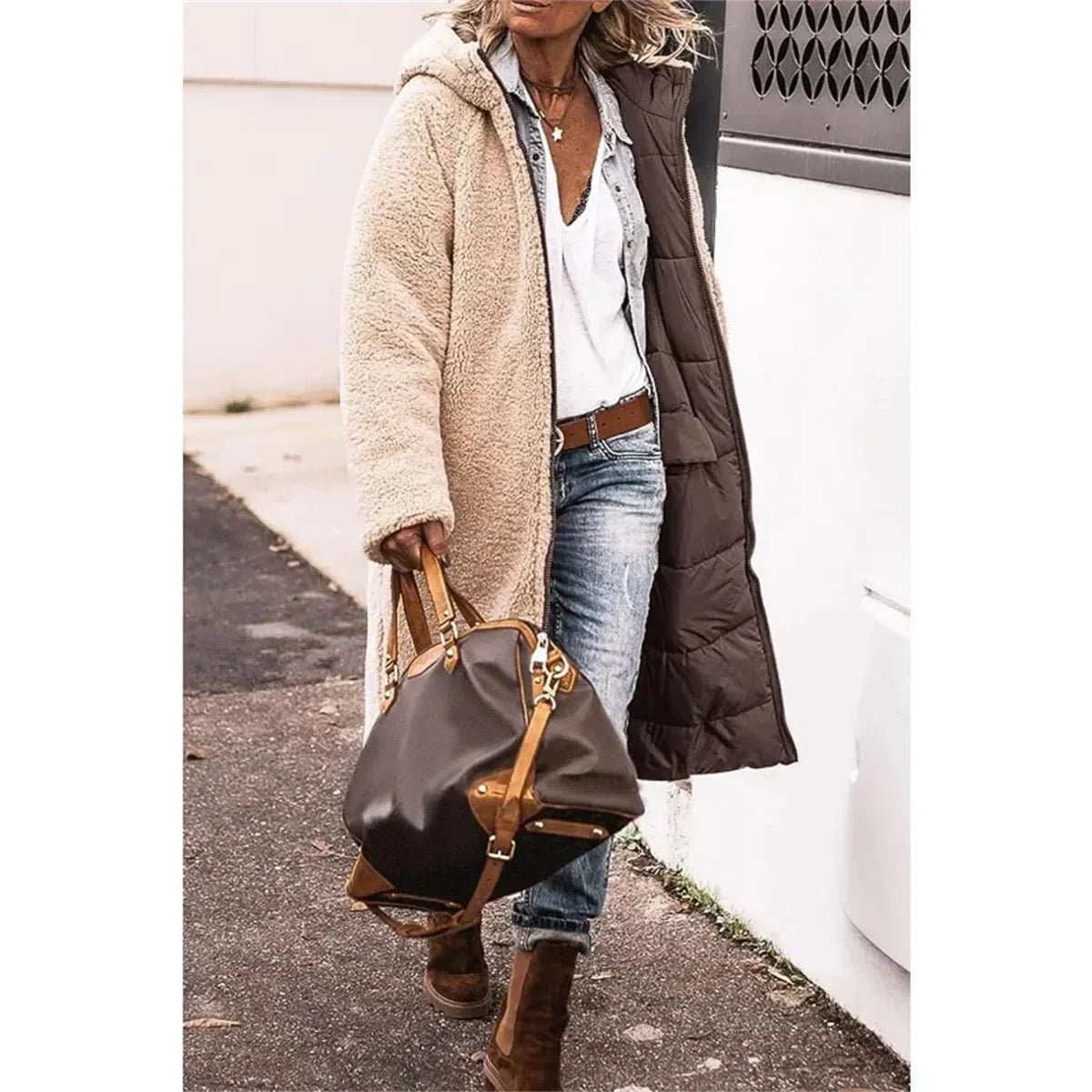 Premium women's winter puffer jacket featuring a warm hood, quilted material, and practical pockets, combining luxury style and functionality.