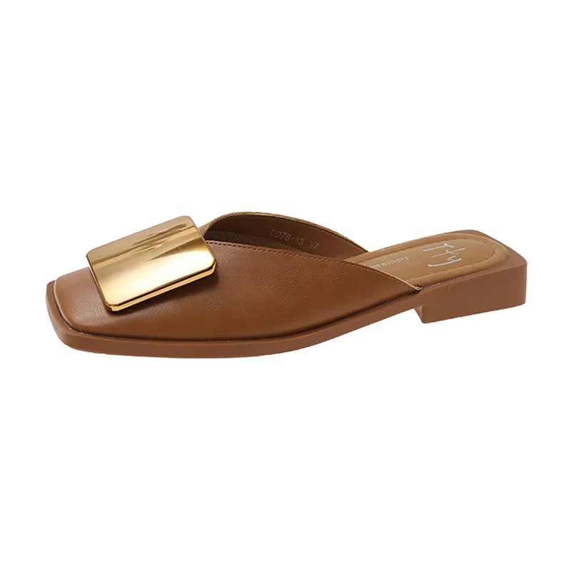 Summer fashion women's slippers with a flat heel and fashionable shallow cut, accentuating sophistication.