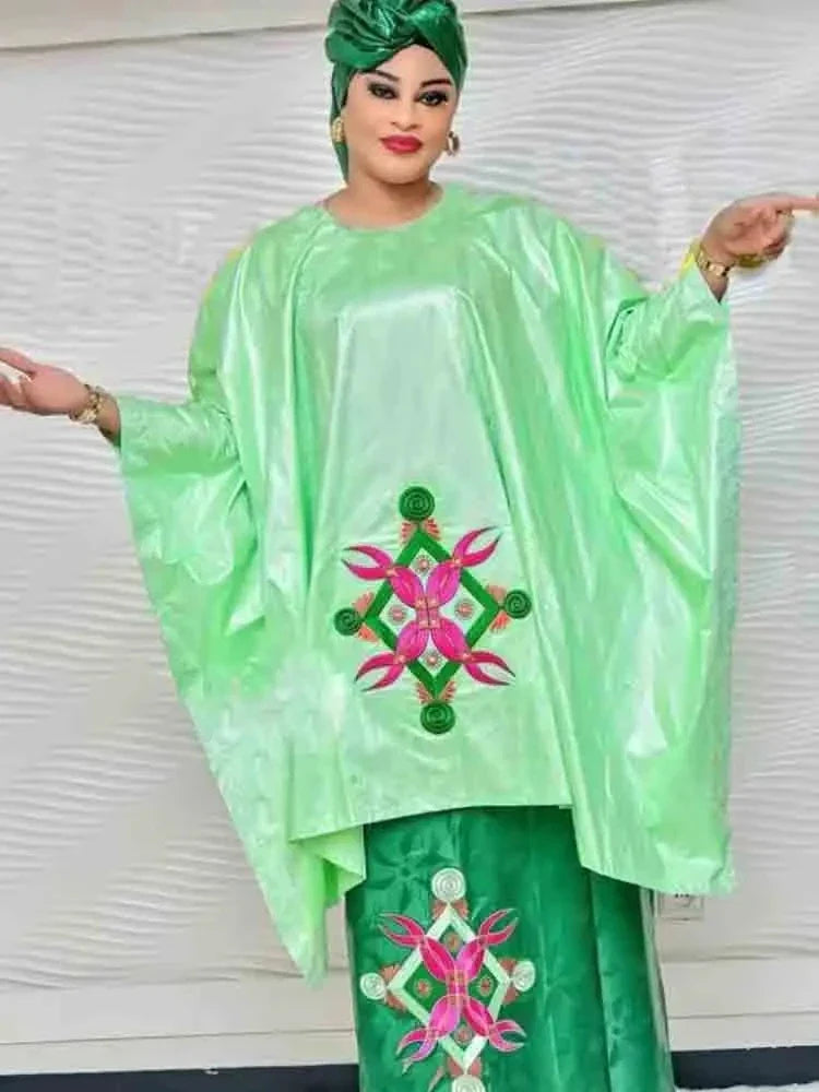 Elegant green Bazin Riche long dress set featuring a beautifully printed Dashiki Boubou skirt and top for women, combining traditional African style with modern luxury.