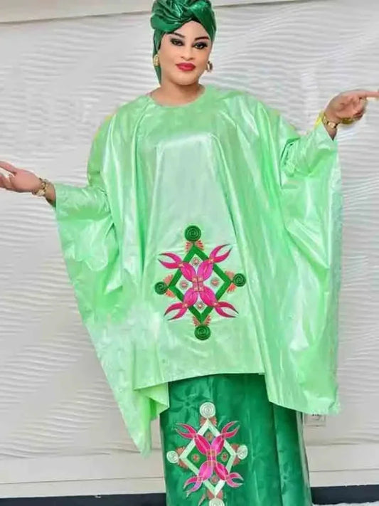 Elegant green Bazin Riche long dress set featuring a beautifully printed Dashiki Boubou skirt and top for women, combining traditional African style with modern luxury.