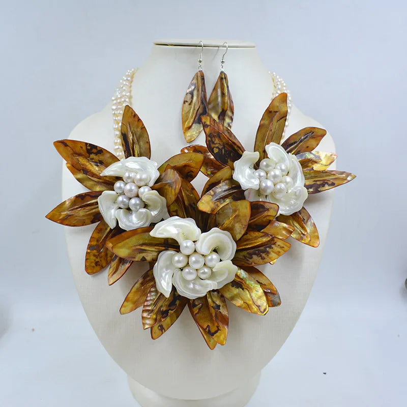 Close-up view of crystal-embellished shell flowers in a luxurious women's wedding necklace, showcasing intricate design and craftsmanship.