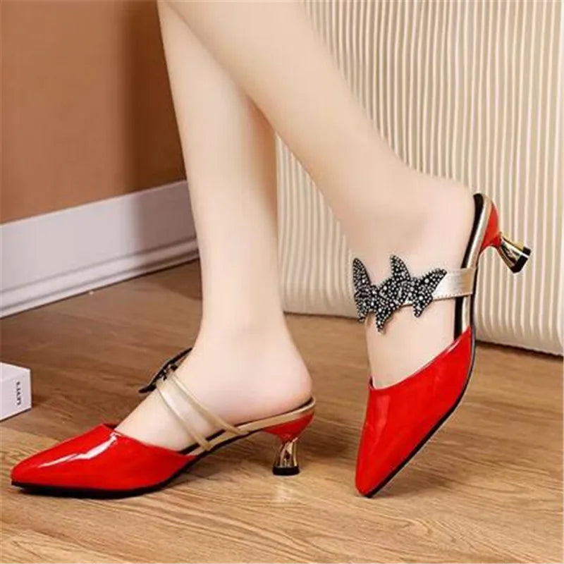 Elegant pointed designer slides with rhinestones, showcasing luxurious detailing and a slip-on design, perfect for spring and autumn occasions.