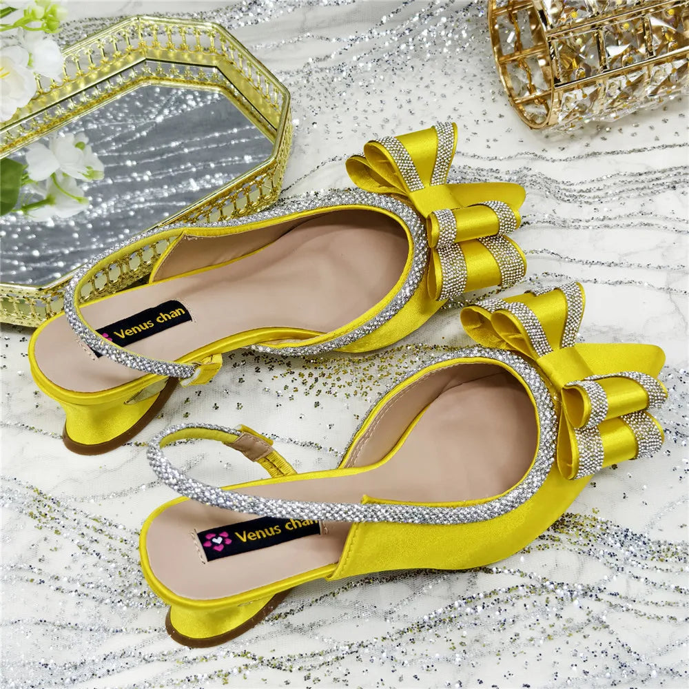 Glamorous women's peep toe pumps featuring a luxurious crystal chain embellishment, designed for sophisticated parties and upscale events.