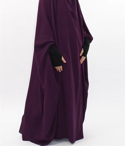 Sleek silhouette of the abaya dress for Muslim women, emphasizing the slight stretch feature for ultimate comfort and elegant style.