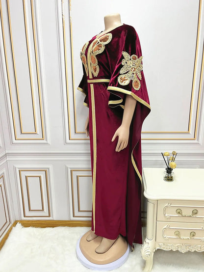 Elegant golden velvet abaya with sequins, showcasing luxurious bat sleeves for sophisticated Muslim fashion during Ramadan.