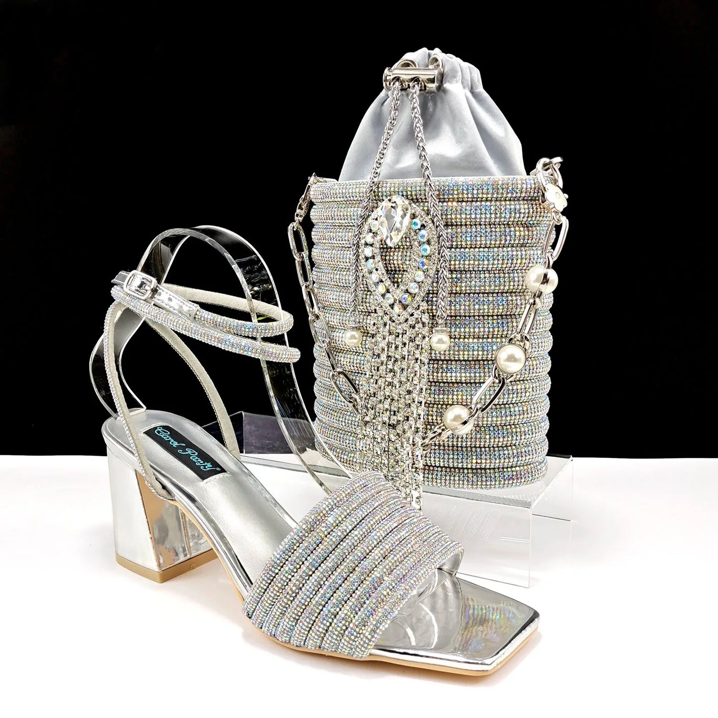 Elegant matching bag set accompanied by luxury olive green peep toe pumps adorned with shimmering rhinestones, offering sophistication for women.