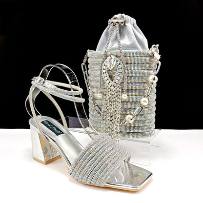 Elegant matching bag set accompanied by luxury olive green peep toe pumps adorned with shimmering rhinestones, offering sophistication for women.