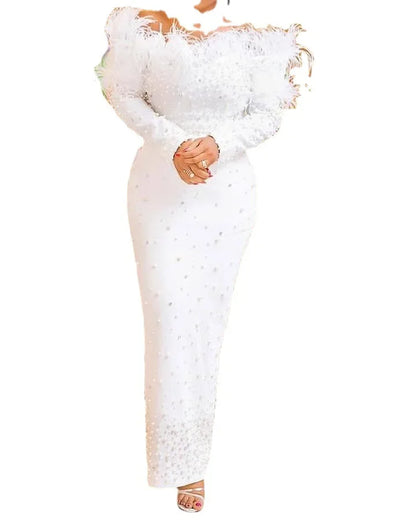 Close-up of the intricate knit fabric of a sophisticated white dress, ideal for women seeking stylish plus size Kanga clothing.