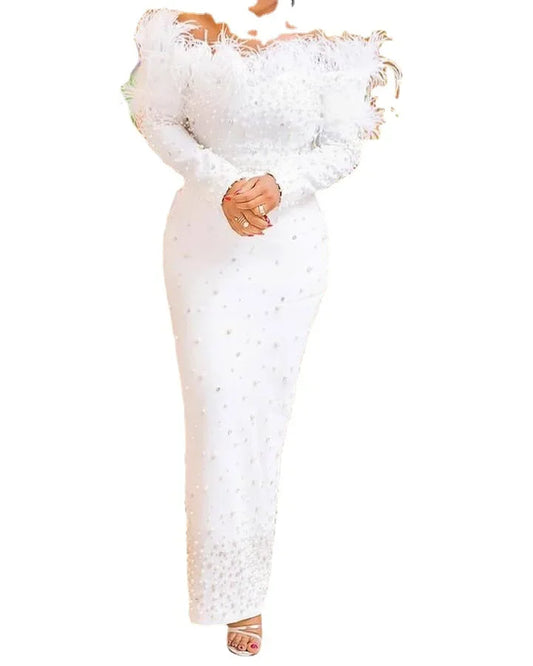 Close-up of the intricate knit fabric of a sophisticated white dress, ideal for women seeking stylish plus size Kanga clothing.