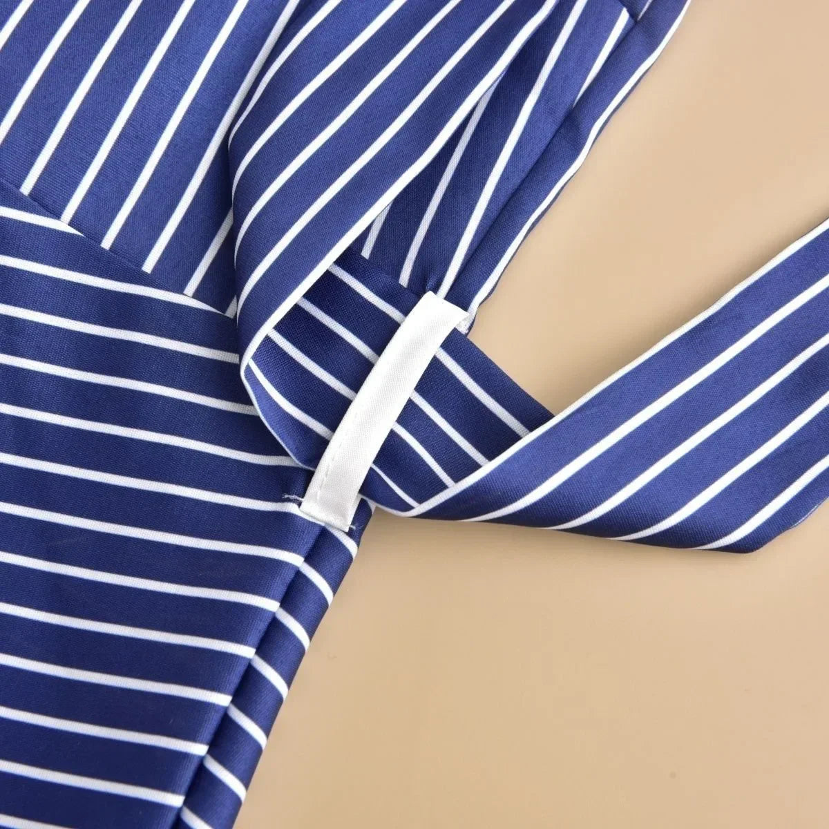 Close-up of the sophisticated patchwork detailing on the plus size summer casual two-piece set, showcasing intricate design elements and luxurious fabric.