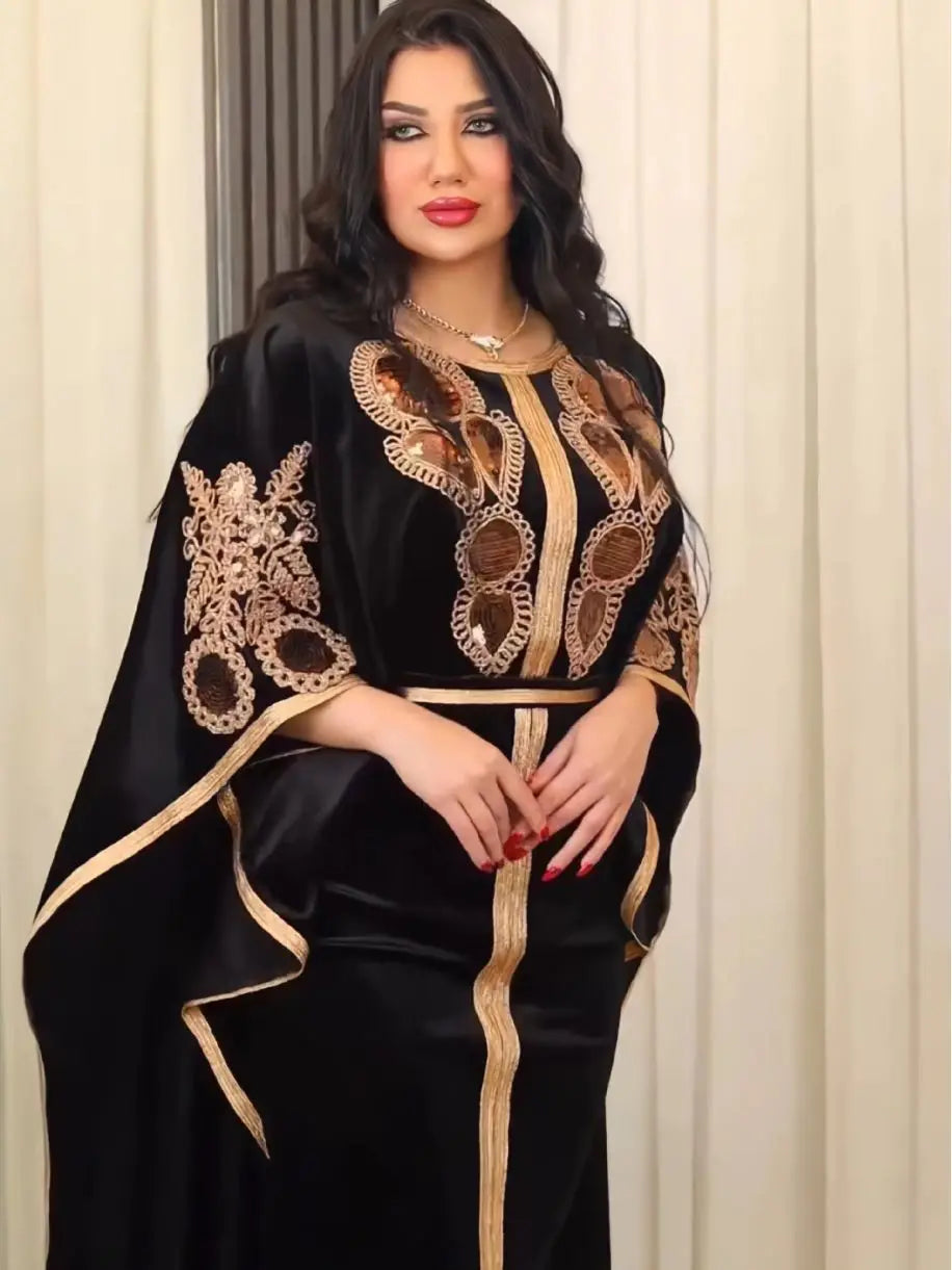 Luxurious Moroccan Dubai dress, crafted from plush golden velvet, showcasing an exquisite design with short bat sleeves for graceful movement during festive occasions.
